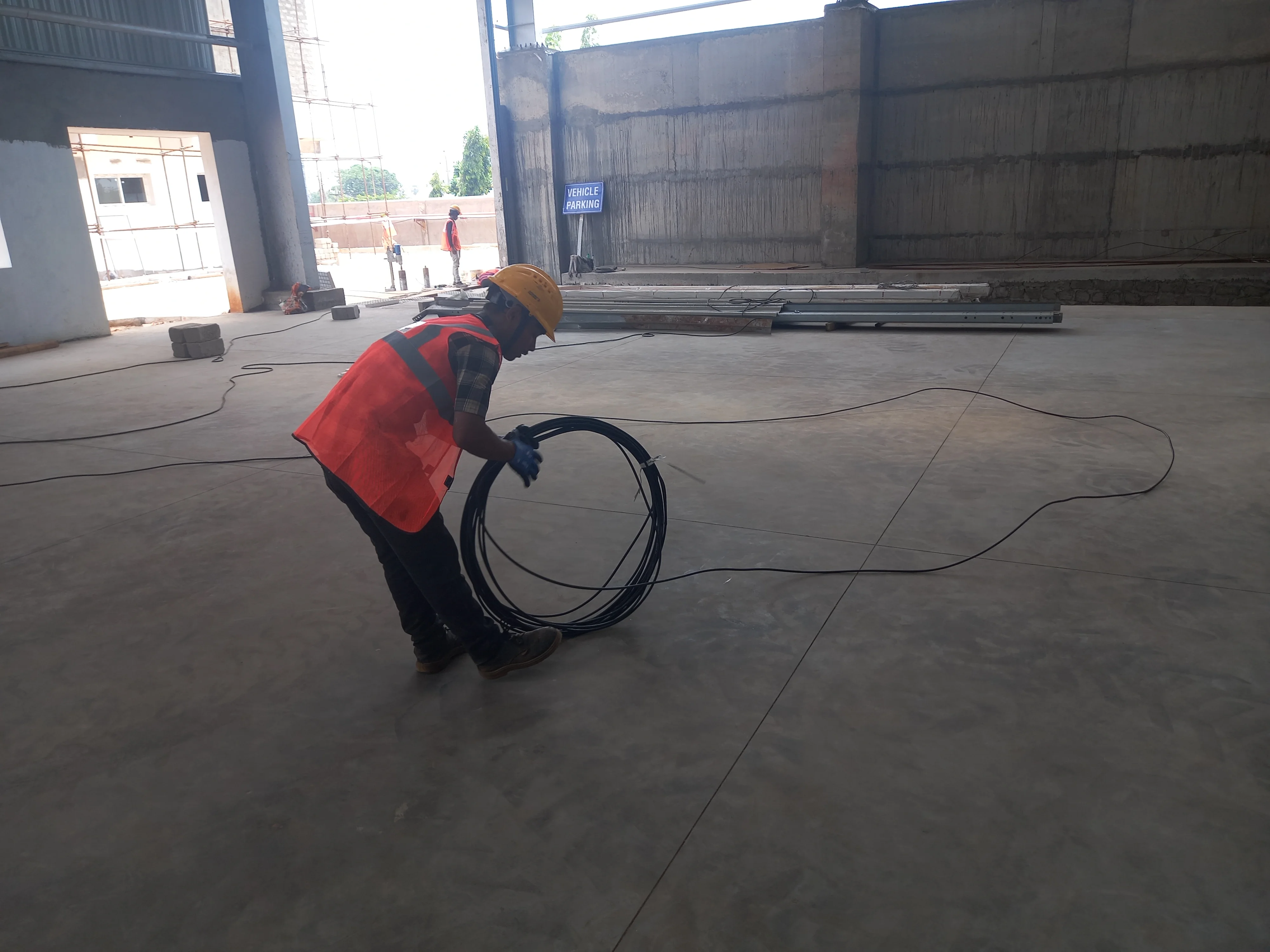 Technicians laying optical fiber cable
